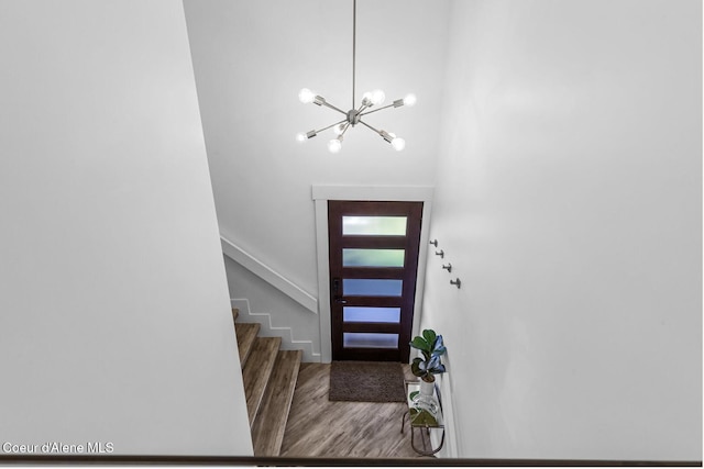 2840 W Masters Dr, Coeur Dalene, ID 83815 - foyer entrance with a chandelier, wood finished floors, and stairway