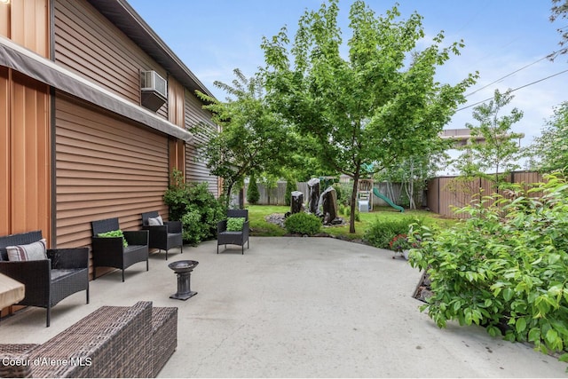 2840 W Masters Dr, Coeur Dalene, ID 83815 - fenced backyard featuring a patio area and a playground