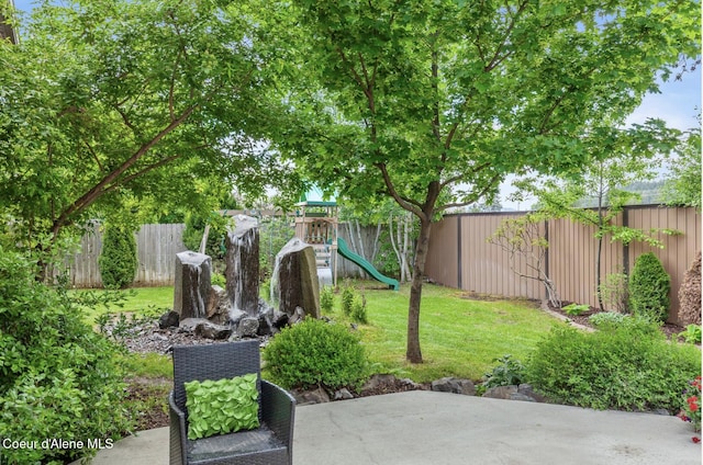 2840 W Masters Dr, Coeur Dalene, ID 83815 - view of yard featuring a playground and a patio