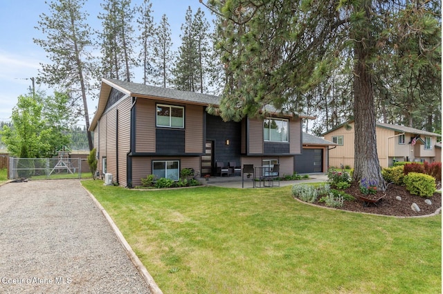 2840 W Masters Dr, Coeur Dalene, ID 83815 - split foyer home featuring a gate, driveway, a garage, a patio area, and roof with shingles