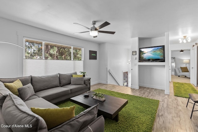 2840 W Masters Dr, Coeur Dalene, ID 83815 - living area featuring light wood-type flooring, a ceiling fan, baseboards, and beverage cooler