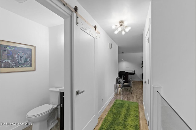 2840 W Masters Dr, Coeur Dalene, ID 83815 - hallway with light wood-type flooring and a barn door