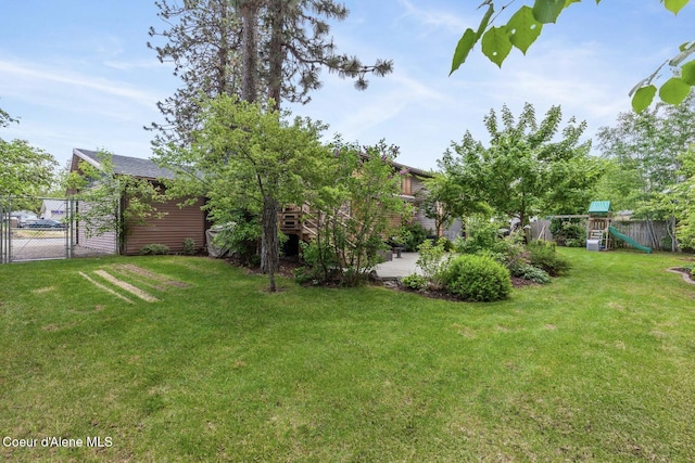 2840 W Masters Dr, Coeur Dalene, ID 83815 - view of yard featuring a playground, a patio, and a gate