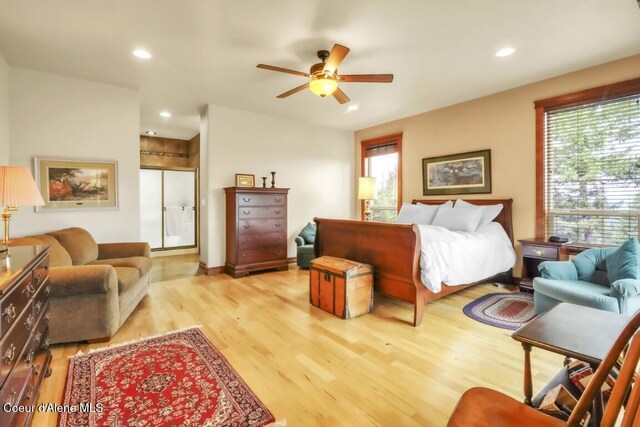 558 Grouse Hill Rd, Bonners Ferry, ID 83805 - bedroom featuring light wood-style floors, multiple windows, recessed lighting, and a ceiling fan