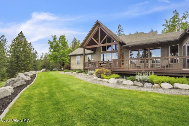 558 Grouse Hill Rd, Bonners Ferry, ID 83805 - rear view of property with a lawn, a wooden deck, and roof with shingles