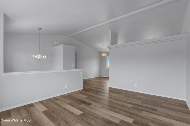 2230 N Methow Ct, Post Falls, ID 83854 - empty room with a chandelier, wood finished floors, lofted ceiling, and baseboards