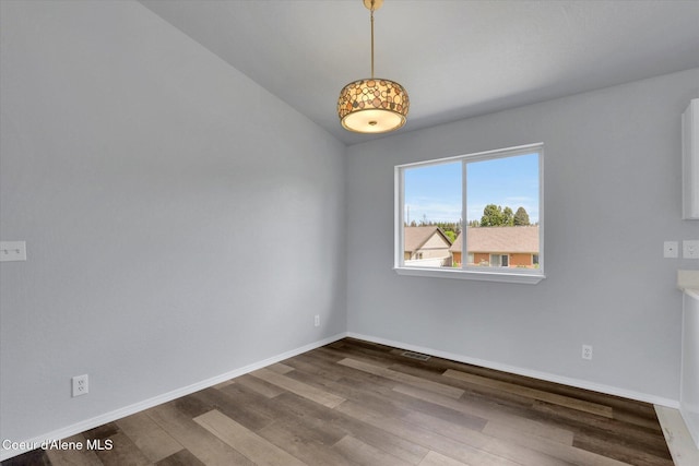 2230 N Methow Ct, Post Falls, ID 83854 - spare room with wood finished floors, baseboards, and lofted ceiling