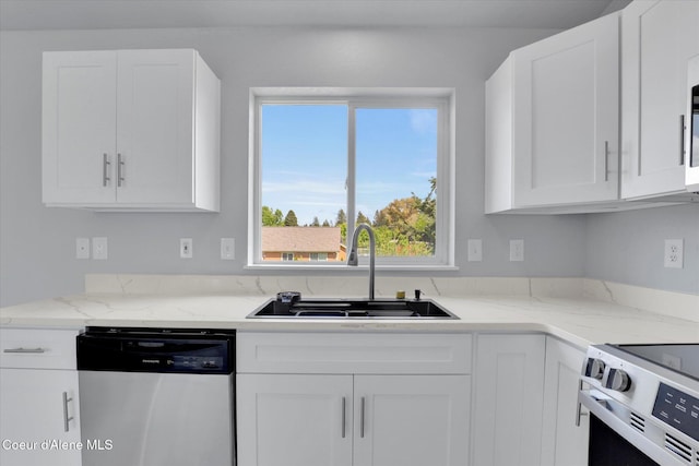 2230 N Methow Ct, Post Falls, ID 83854 - kitchen with stainless steel dishwasher, a sink, white cabinets, and electric range