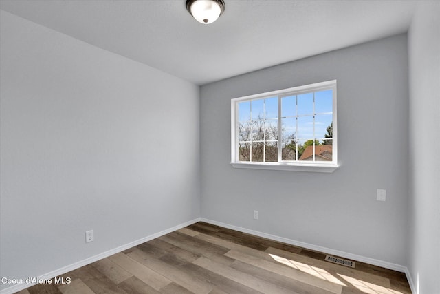 2230 N Methow Ct, Post Falls, ID 83854 - spare room featuring wood finished floors and baseboards