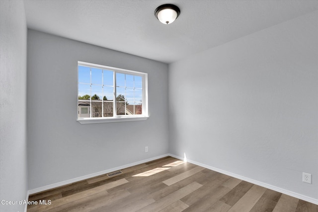 2230 N Methow Ct, Post Falls, ID 83854 - unfurnished room featuring wood finished floors and baseboards
