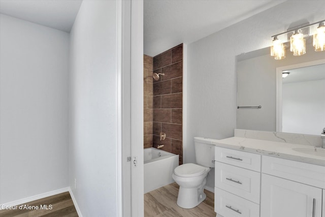 2230 N Methow Ct, Post Falls, ID 83854 - bathroom featuring vanity, wood finished floors, toilet, shower / tub combination, and a chandelier