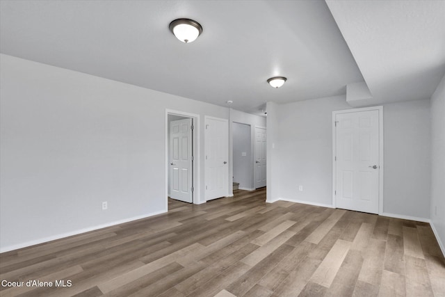 2230 N Methow Ct, Post Falls, ID 83854 - unfurnished bedroom with wood finished floors and baseboards