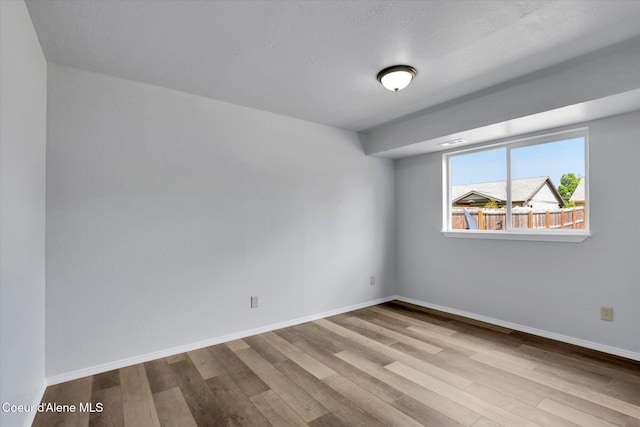 2230 N Methow Ct, Post Falls, ID 83854 - spare room featuring wood finished floors and baseboards