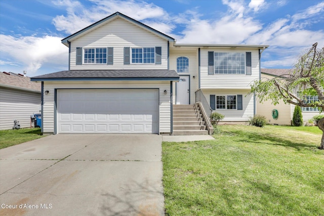 2230 N Methow Ct, Post Falls, ID 83854 - bi-level home featuring driveway, a front lawn, and an attached garage