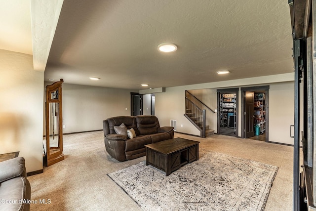 14441 N Pristine Cir, Rathdrum, ID 83858 - living room with carpet flooring, stairway, recessed lighting, baseboards, and a textured ceiling