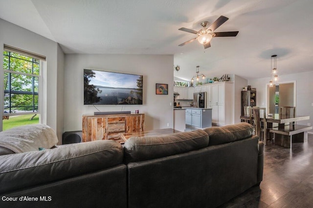 9147 N Entiate Dr, Hayden, ID 83835 - living room featuring lofted ceiling, ceiling fan, and dark wood-type flooring