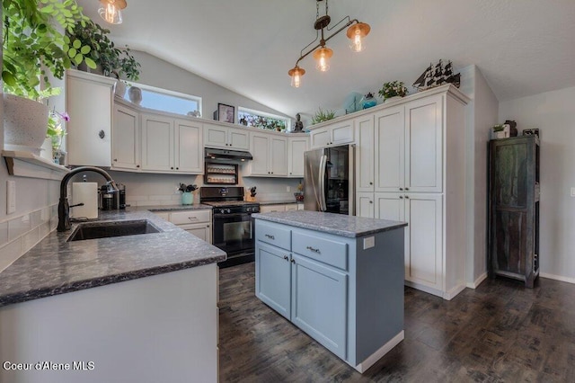 9147 N Entiate Dr, Hayden, ID 83835 - kitchen with black gas range, fridge, a sink, lofted ceiling, and under cabinet range hood