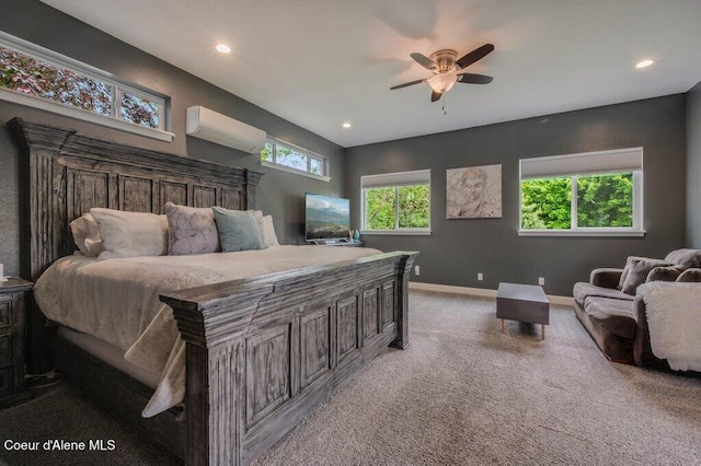 9147 N Entiate Dr, Hayden, ID 83835 - carpeted bedroom with a wall mounted air conditioner, recessed lighting, baseboards, and a ceiling fan