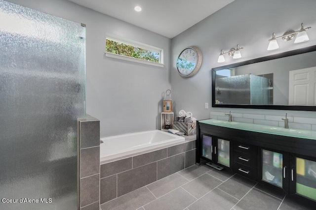 9147 N Entiate Dr, Hayden, ID 83835 - bathroom with tile patterned flooring, a bath, a shower stall, and double vanity