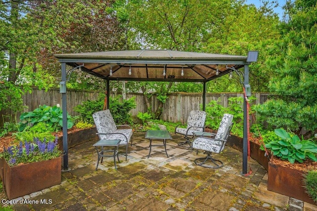 9147 N Entiate Dr, Hayden, ID 83835 - fenced backyard with a gazebo and a patio