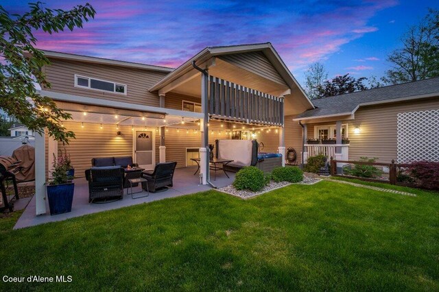 9147 N Entiate Dr, Hayden, ID 83835 - back of house featuring an outdoor hangout area and a patio area