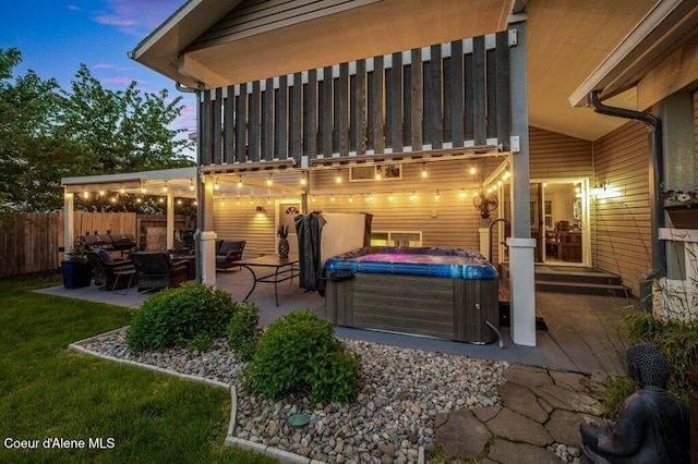 9147 N Entiate Dr, Hayden, ID 83835 - view of patio featuring a hot tub and outdoor lounge area