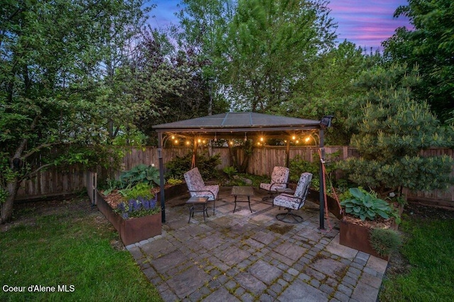 9147 N Entiate Dr, Hayden, ID 83835 - fenced backyard featuring a gazebo and a patio area