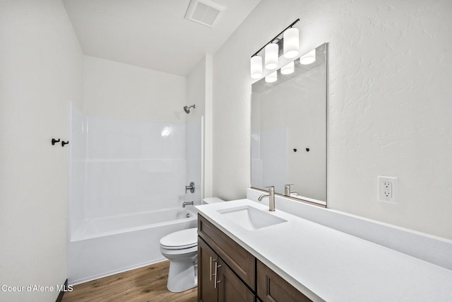 2248 N Syringa St, Post Falls, ID 83854 - full bath with toilet, vanity, wood finished floors, and tub / shower combination