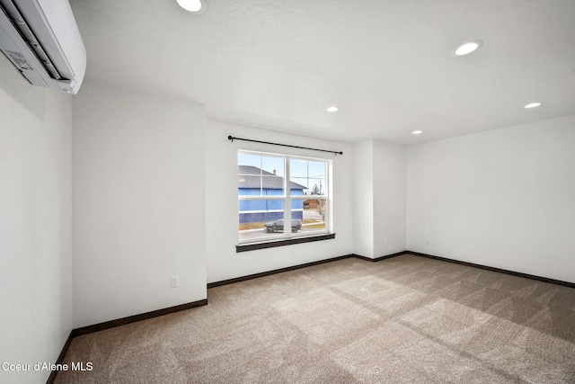 2248 N Syringa St, Post Falls, ID 83854 - empty room featuring a wall mounted air conditioner, carpet flooring, baseboards, and recessed lighting