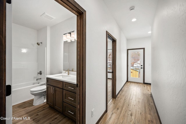 2248 N Syringa St, Post Falls, ID 83854 - hallway featuring a sink, light wood finished floors, and recessed lighting