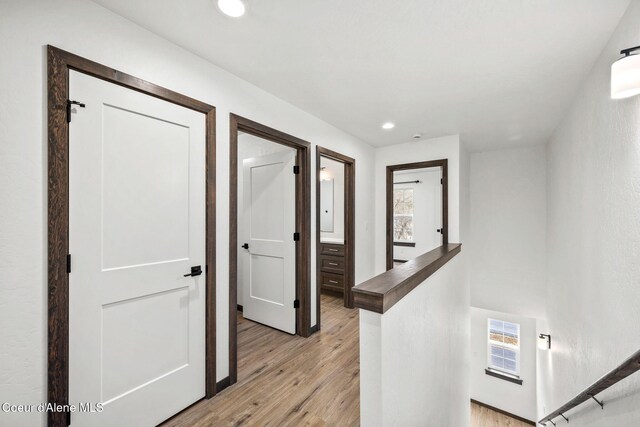 2248 N Syringa St, Post Falls, ID 83854 - corridor with light wood-style flooring and recessed lighting