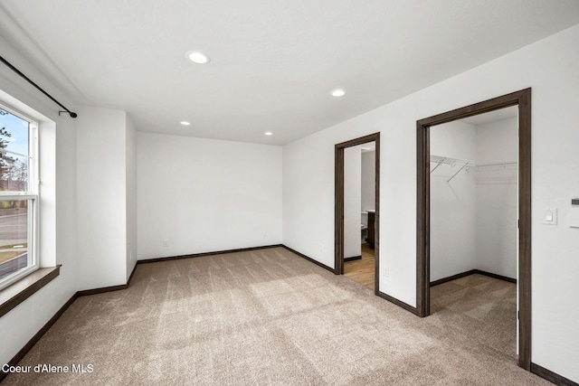2248 N Syringa St, Post Falls, ID 83854 - unfurnished bedroom with carpet floors, a walk in closet, baseboards, recessed lighting, and a closet