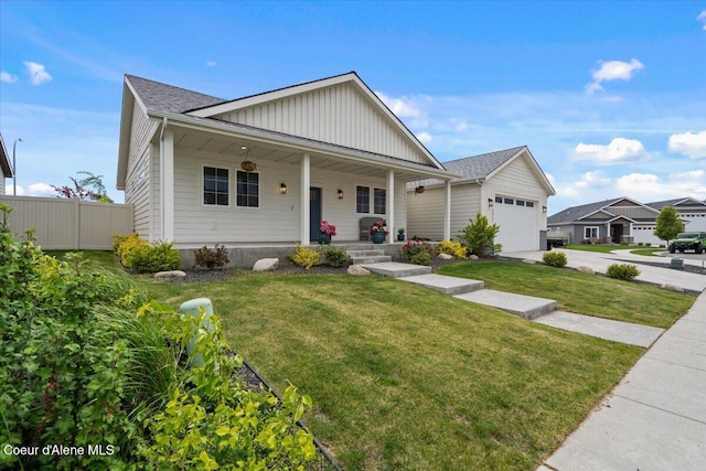 2917 N Bygone Way, Post Falls, ID 83854 - view of front of house featuring covered porch, board and batten siding, and concrete driveway