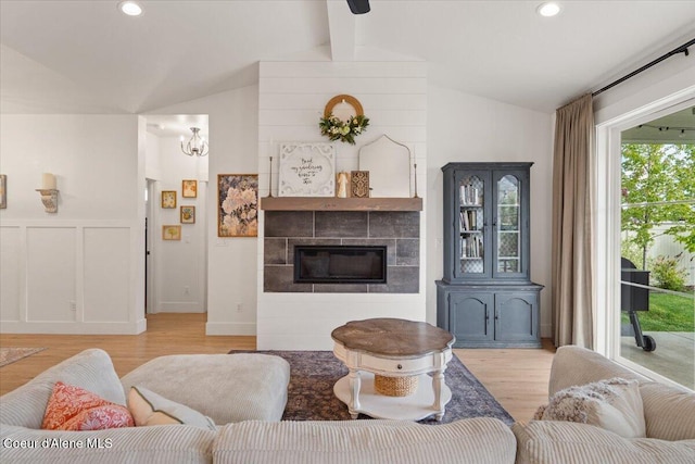 2917 N Bygone Way, Post Falls, ID 83854 - living room with light wood finished floors, a tiled fireplace, and recessed lighting