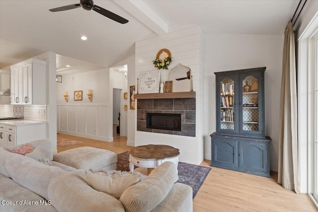 2917 N Bygone Way, Post Falls, ID 83854 - living area with ceiling fan, light wood-style floors, and a tile fireplace