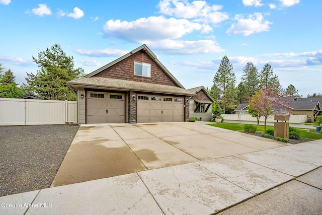 1044 E Maroon Creek Dr, Hayden, ID 83835 - view of front of home featuring driveway and a gate