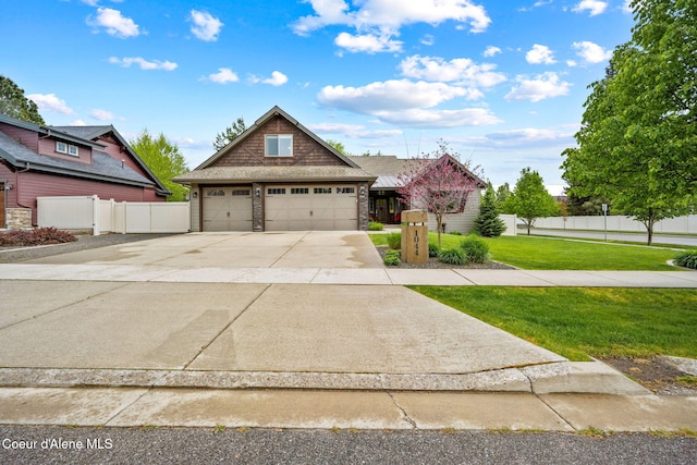 1044 E Maroon Creek Dr, Hayden, ID 83835 - view of front of home featuring a garage and concrete driveway