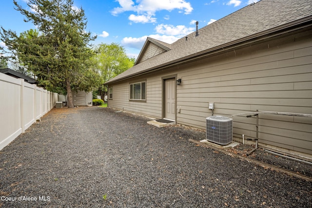 1044 E Maroon Creek Dr, Hayden, ID 83835 - view of side of home with cooling unit and roof with shingles