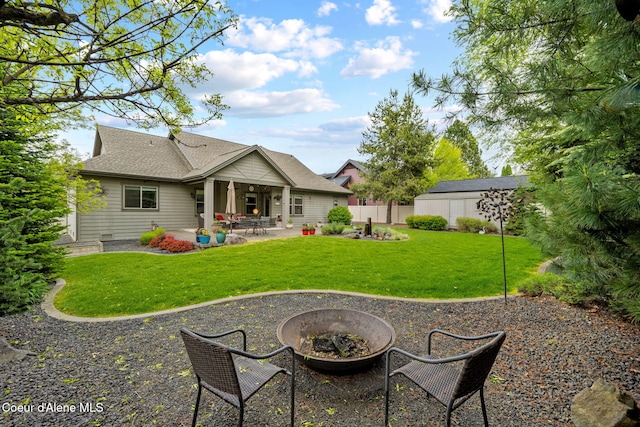 1044 E Maroon Creek Dr, Hayden, ID 83835 - rear view of property featuring a fire pit and a patio area