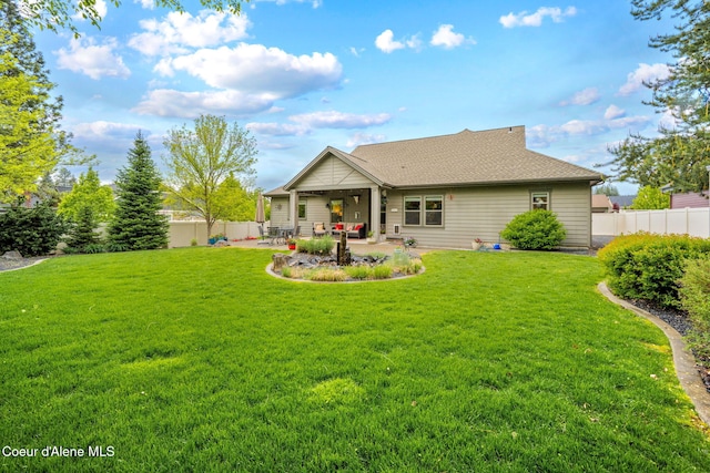 1044 E Maroon Creek Dr, Hayden, ID 83835 - rear view of house featuring a patio area and a shingled roof