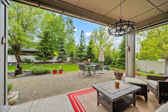 1044 E Maroon Creek Dr, Hayden, ID 83835 - fenced backyard featuring a patio area and outdoor dining space