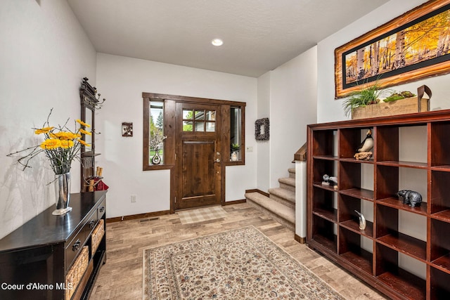 1044 E Maroon Creek Dr, Hayden, ID 83835 - entryway featuring light wood-style flooring, stairway, baseboards, and recessed lighting