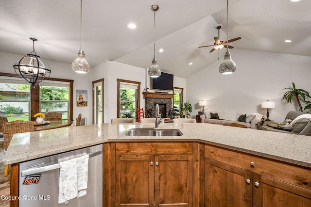 1044 E Maroon Creek Dr, Hayden, ID 83835 - kitchen featuring stainless steel dishwasher, open floor plan, a sink, brown cabinetry, and recessed lighting