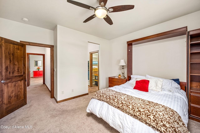 1044 E Maroon Creek Dr, Hayden, ID 83835 - bedroom featuring light carpet, baseboards, and a ceiling fan