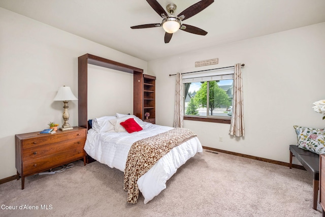 1044 E Maroon Creek Dr, Hayden, ID 83835 - carpeted bedroom with baseboards and ceiling fan
