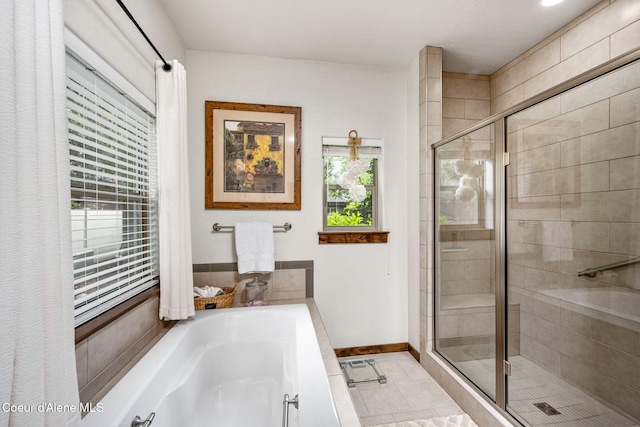 1044 E Maroon Creek Dr, Hayden, ID 83835 - bathroom featuring a garden tub, a stall shower, baseboards, and tile patterned flooring
