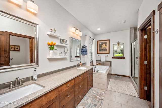 1044 E Maroon Creek Dr, Hayden, ID 83835 - full bath with tile patterned flooring, a garden tub, double vanity, a stall shower, and recessed lighting
