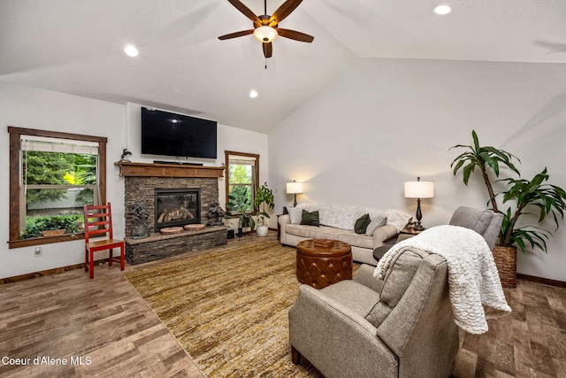 1044 E Maroon Creek Dr, Hayden, ID 83835 - living area featuring baseboards, wood finished floors, vaulted ceiling, ceiling fan, and plenty of natural light