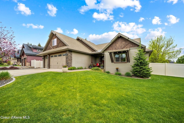 1044 E Maroon Creek Dr, Hayden, ID 83835 - view of front of property featuring driveway, stone siding, a garage, and a shingled roof