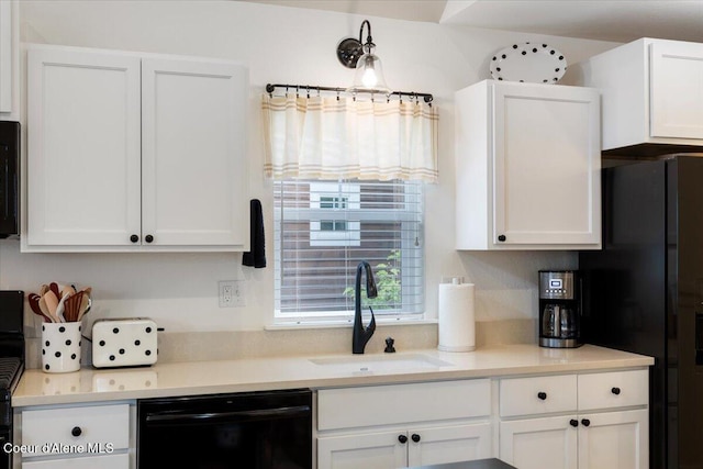 199 Pomrankey Ln, Dover, ID 83825 - kitchen with black appliances, a sink, white cabinetry, and light countertops